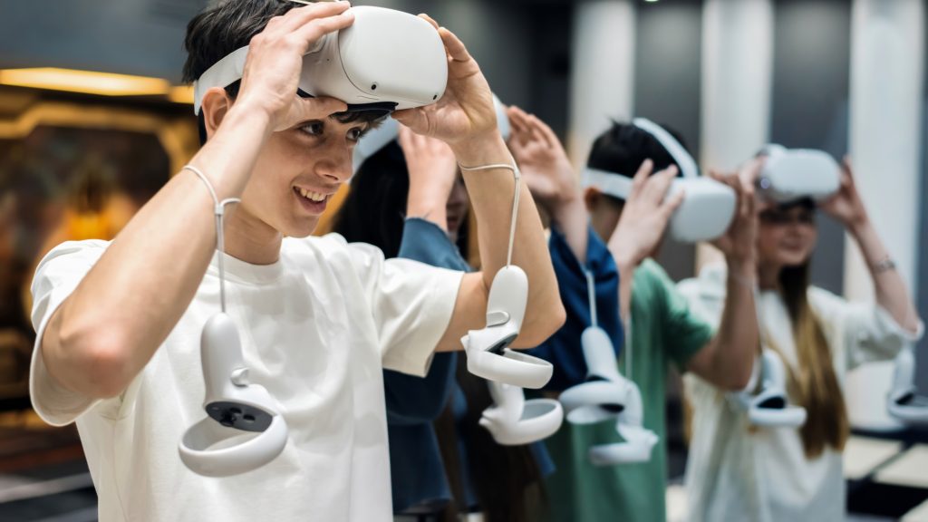 Teenagers wearing VR equipmentt